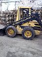 Фронтальный погрузчик New Holland Skidsteer 555 (2)