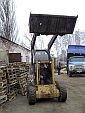 Фронтальный погрузчик New Holland Skidsteer 555 (6)